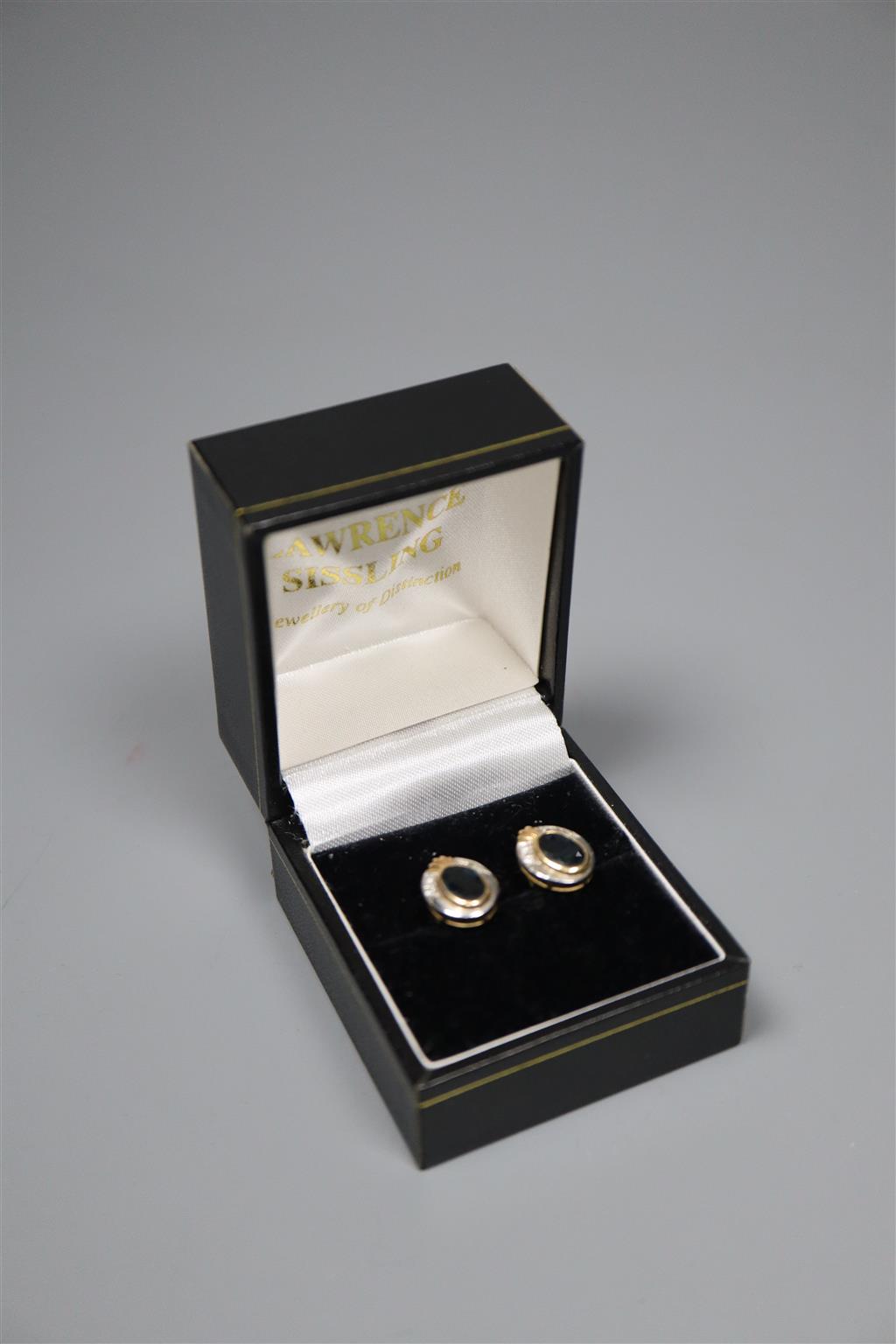A pair of modern yellow and white metal, sapphire and diamond set oval cluster earrings,